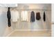 Walk-in closet is ready for all your clothes with installed metal racks for storage at 7027 Butternut Oak Ter, Huntersville, NC 28078