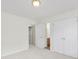 Bedroom with neutral walls, carpet, ceiling light and with closet and bathroom access at 7935 Harrington Woods Rd, Charlotte, NC 28269