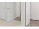 Hallway with carpeting and tile flooring at 7935 Harrington Woods Rd, Charlotte, NC 28269
