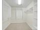 Spacious walk-in closet featuring built-in shelving and ample storage space at 7935 Harrington Woods Rd, Charlotte, NC 28269