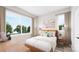 Sunlit bedroom with large windows and comfortable furnishings at 8048 Cedarsmith Ct, Charlotte, NC 28217