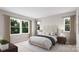 Spacious bedroom with a neutral color scheme and large windows offering ample natural light at 8048 Cedarsmith Ct, Charlotte, NC 28217