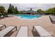 Sparkling community pool with ample lounge chairs, offering a refreshing oasis for residents at 8810 Cool Meadow Dr, Huntersville, NC 28078