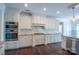 Gourmet kitchen with modern appliances, granite countertops, and custom cabinetry at 8810 Cool Meadow Dr, Huntersville, NC 28078