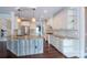 Bright kitchen with large island, granite countertops, stainless steel appliances and hardwood floors at 8810 Cool Meadow Dr, Huntersville, NC 28078