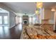 Open-concept kitchen with an island, granite counters, and a view of the living room at 8810 Cool Meadow Dr, Huntersville, NC 28078