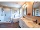 Luxurious main bathroom with double vanity, freestanding tub, glass shower and elegant fixtures at 8810 Cool Meadow Dr, Huntersville, NC 28078