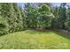 Large backyard featuring a lush lawn and privacy fencing, perfect for outdoor enjoyment and relaxation at 9312 Seamill Rd, Charlotte, NC 28278