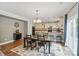 Dining area open to kitchen with stainless appliances, eat in bar and sliding glass door at 9312 Seamill Rd, Charlotte, NC 28278