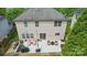 Back exterior view showing a patio with furniture and well-maintained backyard at 9312 Seamill Rd, Charlotte, NC 28278