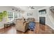 Comfortable living room featuring hardwood floors, a fireplace, and neutral-colored furniture at 9312 Seamill Rd, Charlotte, NC 28278