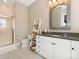 View of a bright bathroom with glass shower, tiled floor, and granite vanity at 9636 Cotton Stand Rd, Charlotte, NC 28277