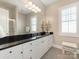 Spacious bathroom with a large mirror, granite countertop, and bright natural light at 9636 Cotton Stand Rd, Charlotte, NC 28277