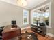 Bright office with a desk, natural light from a large window, and hardwood floors at 9636 Cotton Stand Rd, Charlotte, NC 28277