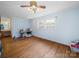 Bedroom with hardwood floors and natural light streaming through the windows at 101 Stoneybrook Dr, York, SC 29745