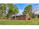 Charming brick home with a well-manicured lawn and mature trees, creating a welcoming curb appeal at 101 Stoneybrook Dr, York, SC 29745