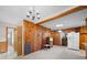 Open kitchen/dining area with wood paneling, chandelier, and plenty of room to entertain at 101 Stoneybrook Dr, York, SC 29745