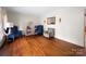 Cozy living room showcasing hardwood floors, ample natural light, and comfortable seating at 101 Stoneybrook Dr, York, SC 29745