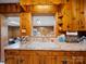 Close-up of kitchen sink with wood cabinetry, marble countertops, and stainless steel fixtures at 101 Stoneybrook Dr, York, SC 29745