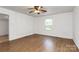 Bright, simple bedroom featuring a ceiling fan, a window, and wood floors at 1043 Sid Davis Rd, Chester, SC 29706