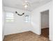 Bright bedroom featuring a ceiling fan, two windows, and wood-look flooring at 1043 Sid Davis Rd, Chester, SC 29706