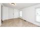 Bedroom featuring a neutral wall, white door, and beige flooring at 1043 Sid Davis Rd, Chester, SC 29706
