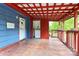 Exterior shot of the porch featuring blue siding and a red ceiling at 1043 Sid Davis Rd, Chester, SC 29706