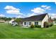 Large backyard with green lawn and mature landscaping at 113 Hidden Creek Dr, Salisbury, NC 28147