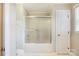 Clean bathroom featuring tiled shower, sliding glass door, and white walls at 113 Hidden Creek Dr, Salisbury, NC 28147