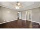 Spacious bedroom features hardwood floors, ceiling fan, and access to other rooms at 113 Hidden Creek Dr, Salisbury, NC 28147