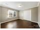 Spacious bedroom with hardwood floors, natural light, and a double door closet at 113 Hidden Creek Dr, Salisbury, NC 28147