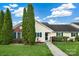 Charming home with green lawn, landscaping, and tall evergreen trees enhancing curb appeal at 113 Hidden Creek Dr, Salisbury, NC 28147