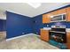 Bright kitchen with oak cabinets, tile flooring, and stainless steel appliances at 113 Hidden Creek Dr, Salisbury, NC 28147