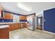 Spacious kitchen with stainless steel appliances, wood cabinets, and tile flooring at 113 Hidden Creek Dr, Salisbury, NC 28147