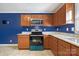Charming kitchen featuring oak cabinets, granite counters, and stainless steel oven at 113 Hidden Creek Dr, Salisbury, NC 28147