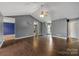 Spacious living room with dark hard wood flooring and neutral walls at 113 Hidden Creek Dr, Salisbury, NC 28147