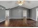 Spacious living room featuring dark hardwood floors, neutral wall color and a ceiling fan at 113 Hidden Creek Dr, Salisbury, NC 28147
