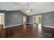 The living room has hardwood floors, a fan, and neutral wall colors at 113 Hidden Creek Dr, Salisbury, NC 28147