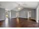 Bright living room featuring hard wood floors, fan, and neutral paint at 113 Hidden Creek Dr, Salisbury, NC 28147