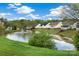 Community pond featuring water fountain and well-manicured lawns at 113 Hidden Creek Dr, Salisbury, NC 28147
