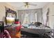 Bedroom with natural light from the window and hardwood floors, offering a glimpse of the exterior at 115 E 11Th St, Salisbury, NC 28144