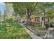 Charming front yard and vintage front porch, complete with a brick pillar facade and decorative shrubbery at 115 E 11Th St, Salisbury, NC 28144