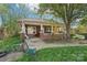 Charming brick home with a covered porch and a lush lawn, perfect for relaxation and curb appeal at 115 E 11Th St, Salisbury, NC 28144