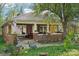 Inviting brick home with a covered porch, featuring a unique blend of classic design and curb appeal at 115 E 11Th St, Salisbury, NC 28144