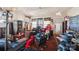 View of the living room featuring natural light, hardwood floors, and access to the front door at 115 E 11Th St, Salisbury, NC 28144