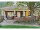 Welcoming front porch with brick detailing and decorative elements, perfect for relaxing outdoors at 115 E 11Th St, Salisbury, NC 28144