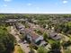 A high aerial view showcases the community with trees, roads, and parking at 11839 Ridgeway Park Dr, Charlotte, NC 28277