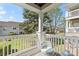 Inviting balcony with comfortable seating and a scenic view of the surrounding greenery at 11839 Ridgeway Park Dr, Charlotte, NC 28277