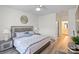 Spacious bedroom with hardwood floors, decorative wall art, and a comfortable queen-sized bed at 11839 Ridgeway Park Dr, Charlotte, NC 28277
