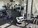 Well-equipped gym with a variety of machines, including treadmills, elliptical, and weights for a complete workout at 11839 Ridgeway Park Dr, Charlotte, NC 28277